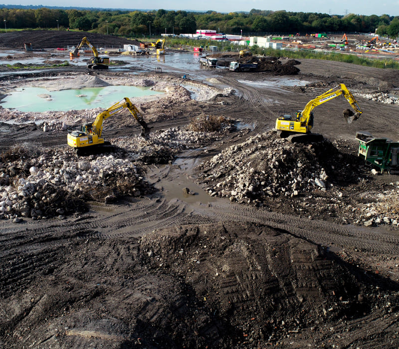 Yellow diggers carrying out remediation work on this brownfield remediation site.