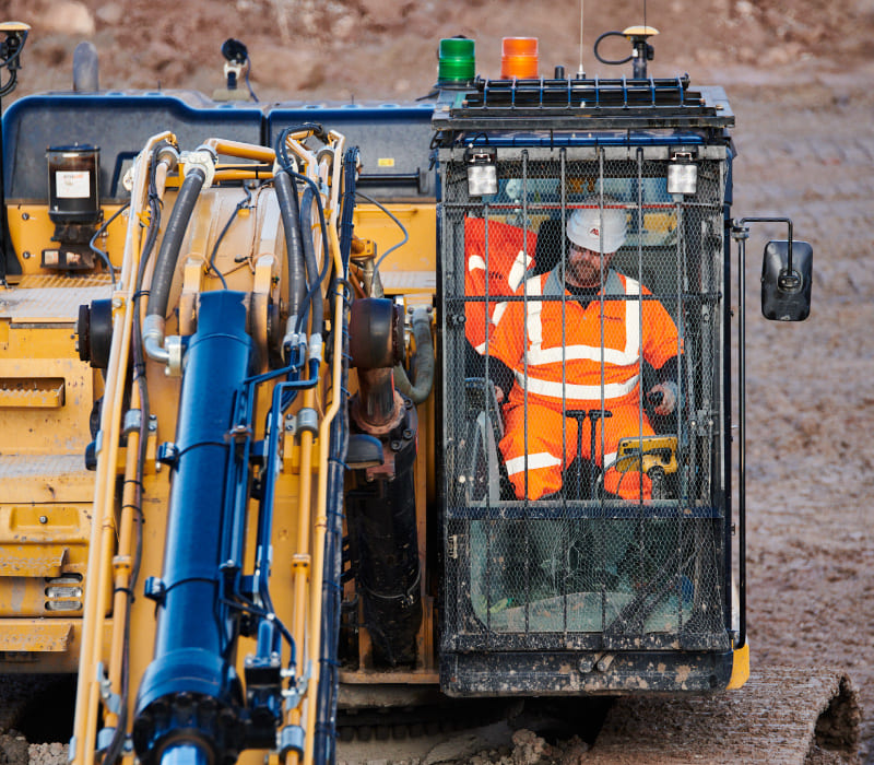 McAuliffe team member operating heavy machinery to unlock this 12.9ha brownfield site for redevelopment into 600 new-build private and affordable homes.